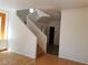 Staircase leads to the upper level with wood steps and a crisp, white railing at 9937 La Paca Ave, Las Vegas, NV 89117
