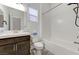 Bright bathroom features a vanity with countertop, a toilet, and a shower-bathtub combo at , Henderson, NV 89011