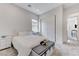 Cozy bedroom featuring carpet flooring, a bench seat, and bright, natural light at , Henderson, NV 89011