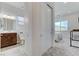 Bright bedroom with a sliding closet, a bathroom and a view of the outside at , Henderson, NV 89011