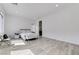 A spacious bedroom with light-colored tile flooring, white walls, and a comfortable bed at , Henderson, NV 89011
