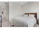 Neutral bedroom features a queen bed with dark wood headboard and bedside table at , Henderson, NV 89011