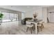 Living room with dining area, tile flooring, and large sliding glass door at , Henderson, NV 89011