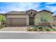 Charming home featuring a desert landscaped yard, brick driveway, and a two-car garage at , Henderson, NV 89011