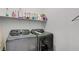Convenient laundry room with modern washer and dryer, and shelving for all your storage needs at , Henderson, NV 89011