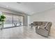 Open-concept living room with tile flooring and a sliding glass door leading to outdoor area at , Henderson, NV 89011