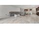 Open-concept living room with tile flooring leading into the kitchen and dining area at , Henderson, NV 89011