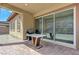 Covered patio with brick pavers, a grill and a sliding glass door leading to the inside of the home at , Henderson, NV 89011
