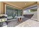 Covered patio with brick pavers and sliding glass door, offering a seamless transition to the home's interior at , Henderson, NV 89011