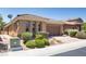 Inviting single-story home showcasing a tile roof, landscape, and paved driveway at , North Las Vegas, NV 89084
