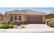 Charming single-story home with a well-manicured front yard and a tile roof at , North Las Vegas, NV 89084