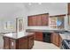 Bright kitchen featuring granite countertops, dark wood cabinets, and a breakfast bar at , North Las Vegas, NV 89084