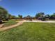 A well-maintained playground with a grassy lawn and shade trees at , North Las Vegas, NV 89084