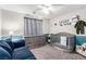 Bedroom with a gray crib, dresser, sofa, and aviation-themed decorations and accents at 10086 Adina Ct, Las Vegas, NV 89141