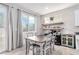 Charming dining area with an island and access to the backyard at 10086 Adina Ct, Las Vegas, NV 89141