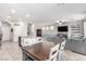 Open concept dining and living room area, great for entertaining guests at 10086 Adina Ct, Las Vegas, NV 89141