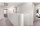 Upstairs hallway featuring neutral carpet and a safety gate at 10086 Adina Ct, Las Vegas, NV 89141