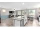 Open-concept kitchen with granite countertops and stainless steel appliances flows into the bright living area at 10086 Adina Ct, Las Vegas, NV 89141