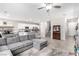 Spacious living room featuring neutral colors, tile floors, and stairs at 10086 Adina Ct, Las Vegas, NV 89141