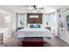 Spacious main bedroom featuring a decorative wooden headboard, ample natural light, and decorative accents at 10086 Adina Ct, Las Vegas, NV 89141