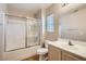 Bright bathroom with tub and shower combo and updated fixtures for a fresh, clean feel at 10456 Prairie Schooner Ave, Las Vegas, NV 89129