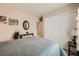 Neutral toned bedroom with a queen bed and a large closet for optimal organization and rest at 10456 Prairie Schooner Ave, Las Vegas, NV 89129
