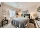Comfortable bedroom features a plush bed, soft lighting, and neutral tones, creating a relaxing retreat at 10456 Prairie Schooner Ave, Las Vegas, NV 89129