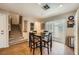 Cozy dining area features wood floors, sliding glass doors, and a staircase in a well-lit space at 10456 Prairie Schooner Ave, Las Vegas, NV 89129