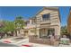 Charming two-story home featuring a covered porch, lovely landscaping, and an attached garage at 10456 Prairie Schooner Ave, Las Vegas, NV 89129