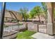 Relaxing front porch with comfortable seating and lush artificial grass at 10456 Prairie Schooner Ave, Las Vegas, NV 89129