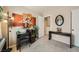 Cozy home office features a desk, shelving unit, and calming decor to create a productive workspace at 10456 Prairie Schooner Ave, Las Vegas, NV 89129