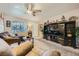Comfortable living room with plush seating, media center, and neutral decor at 10456 Prairie Schooner Ave, Las Vegas, NV 89129