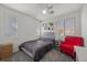 Comfortable bedroom featuring a cozy reading nook, great natural light, and neutral walls at 10468 Concetta Ave, Las Vegas, NV 89129