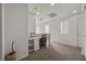 Bonus room with a built-in desk area, neutral walls, and plush carpeting, perfect for a home office or study at 10468 Concetta Ave, Las Vegas, NV 89129