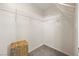 Walk-in closet with metal shelving and carpeted flooring at 10468 Concetta Ave, Las Vegas, NV 89129
