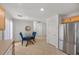 Bright dining area with a glass-top table, seating for four, and an open layout to the kitchen at 10468 Concetta Ave, Las Vegas, NV 89129
