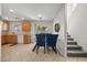 Bright dining area featuring a glass table, seating, and tile flooring at 10468 Concetta Ave, Las Vegas, NV 89129