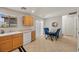 Bright dining area featuring a glass table, seating, and tile flooring at 10468 Concetta Ave, Las Vegas, NV 89129