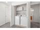 Laundry closet with a full-size washer and dryer unit, offering convenient in-home laundry solutions at 10468 Concetta Ave, Las Vegas, NV 89129
