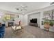 Inviting living room featuring a fireplace, comfortable seating, and stylish decor, creating a warm ambiance at 10468 Concetta Ave, Las Vegas, NV 89129