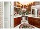 Elegant bathroom featuring dual vanities, mosaic tile accents, and decorative lighting at 10798 Tapestry Winds St, Las Vegas, NV 89141