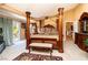 A bedroom is shown with a large bed and access to a balcony at 10798 Tapestry Winds St, Las Vegas, NV 89141