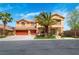 Charming two-story home featuring a spacious three-car garage, lush landscaping, and a welcoming front entrance at 10798 Tapestry Winds St, Las Vegas, NV 89141