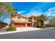 Beautiful home with a three-car garage, mature palm trees, a balcony, and well-maintained landscaping at 10798 Tapestry Winds St, Las Vegas, NV 89141