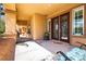 Elegant front entrance showcasing a covered porch and decorative glass double doors, offering a grand welcome at 10798 Tapestry Winds St, Las Vegas, NV 89141