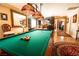 Game room with a pool table, ornate lighting, and decor at 10798 Tapestry Winds St, Las Vegas, NV 89141