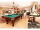 Spacious game room with pool table and comfortable seating area at 10798 Tapestry Winds St, Las Vegas, NV 89141