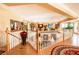 Second story hallway with wood floors, white bannister, and decor at 10798 Tapestry Winds St, Las Vegas, NV 89141