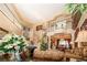 Spacious living room with high ceilings, a grand staircase, and elegant decor, perfect for entertaining guests at 10798 Tapestry Winds St, Las Vegas, NV 89141