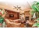 Cozy living room with fireplace, custom built-ins and comfortable seating at 10798 Tapestry Winds St, Las Vegas, NV 89141